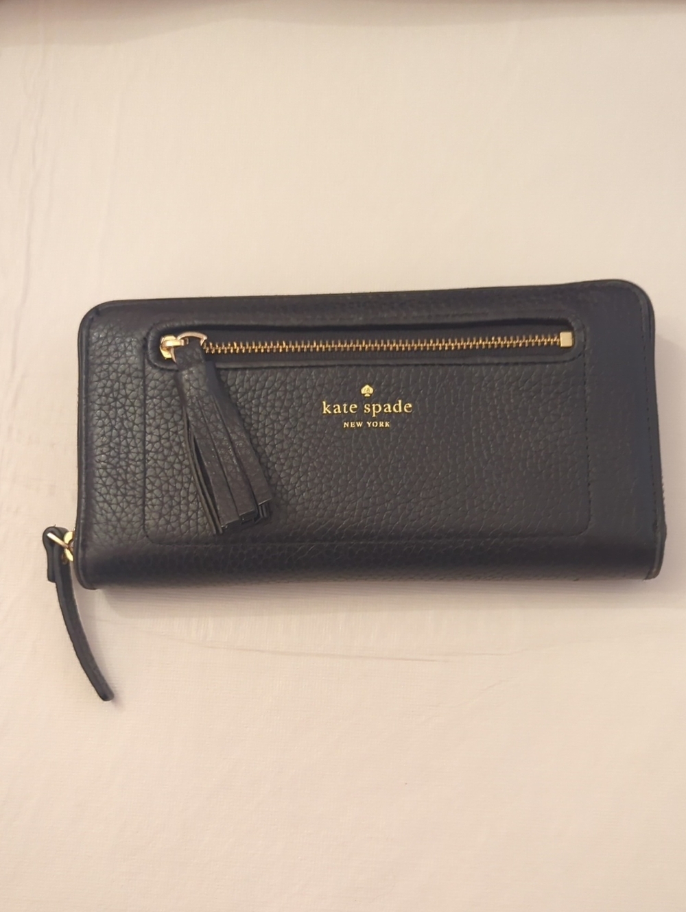 kate spade black pebbled leather tassel zip wallet